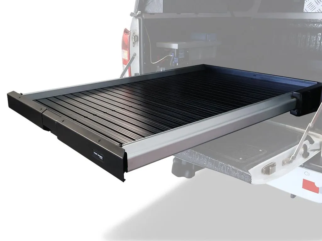 Front Runner Cargo Bed Slide / Medium – Wolf Customs | 4x4 Accessories and Fitment Slide-out cargo bed tray extended from a pickup truck, black slatted platform for loading gear